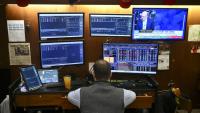 Trader sur le parquet du New York Stock Exchange (NYSE) at  le 19 octobre 2026. 