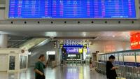 Airports in China cancelled flights and some train services had been affected as China's eastern coast prepared for Typhoon Dolphin