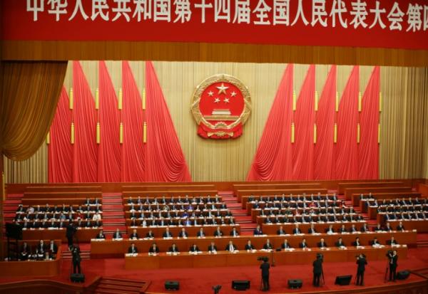 Des délégués assistent à la séance de clôture de l'Assemblée nationale populaire (ANP) au Palais du Peuple à Pékin le 12 mars 2026