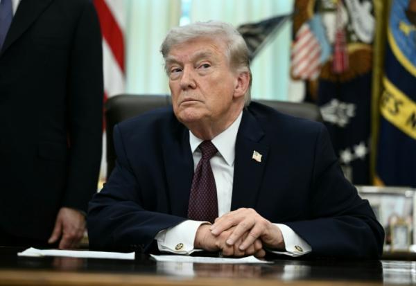 Donald Trump répond aux questions des journalistes, le 31 mars 2026 à la Maison Blanche, à Washington