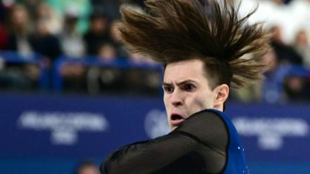 Mikhail Shaidorov lors de son programme libre de patinage artistique le 13 février 2026 sur la patinoire de Milan
où le Kazakhstanais a été sacré champion olympique au terme d'une soirée où le favori américain Ilia Malinin est passé au travers
