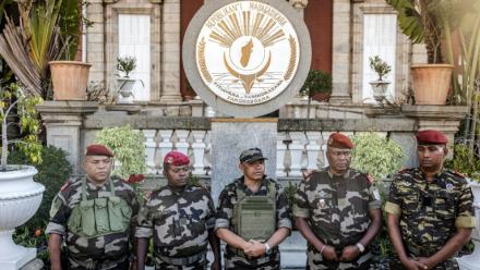 Colonel Michael Randrianirina (C) has pledged to lead the impoverished Indian Ocean island to civilian leadership in under two years