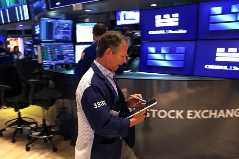 Trader sur le parquet du New York Stock Exchange (NYSE), le 14 mai 2026