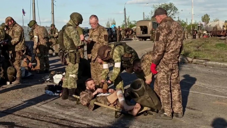 Ukrainian fighter jets searched by pro-Russian troops after surrendering at the exit of Mariupol's Azovstal Iron and Steel (video capture released by the Russian government on May 17, 2022)