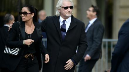 L'animateur de télévision Patrick Sébastien (d) et son épouse Nathalie Boutot aux funérailles de Jacques Chirac, à Paris, le 30 septembre 2019