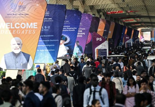 Des visiteurs au Sommet sur l'impact de l'IA, le 17 février 2026 à New Delhi, en Inde