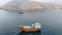 Des bateaux ancrés près du détroit d'Ormuz, au large d'Oman, le 27 juin 2026