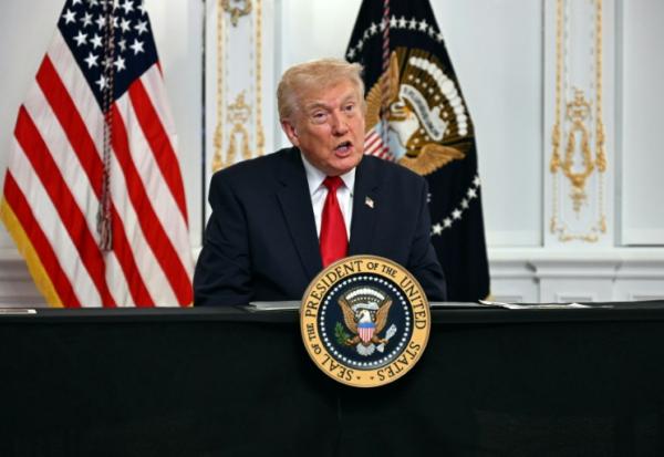 Le président américain Donald Trump participe à un appel vidéo avec des militaires depuis sa résidence de Mar-a-Lago à Palm Beach, en Floride, le 27 novembre 2025