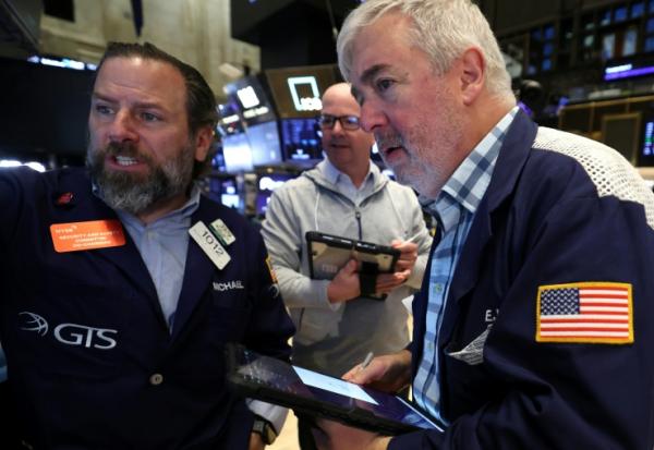 Des opérateurs à la Bourse de New York le 12 mars 2026