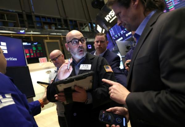 Des opérateurs à la Bourse de New York le 12 mars 2026