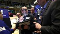 Des opérateurs à la Bourse de New York le 12 mars 2026